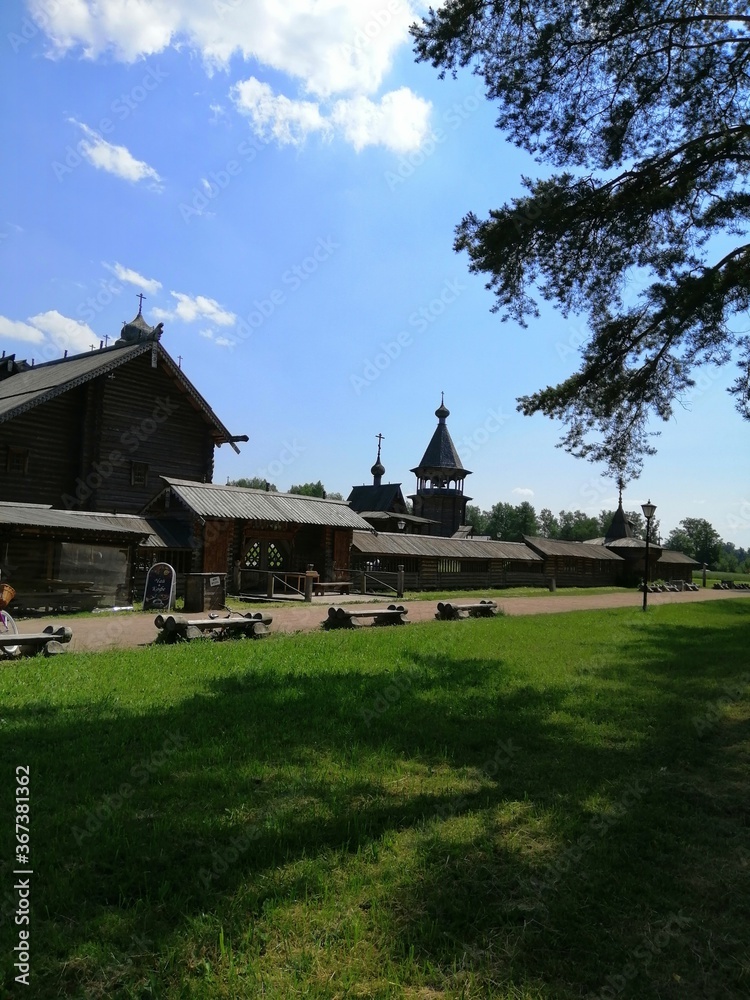 Saint-Petersburg,Russia-07.18.2020: The wooden ancient russian buildings.the Bogoslovka Estate park ensemble in Saint-Petersburg. Saint-Petersburg,Russia-07.18.2020: The wooden ancient russian buildings.the Bogoslovka Estate park ensemble in Saint-Petersburg.