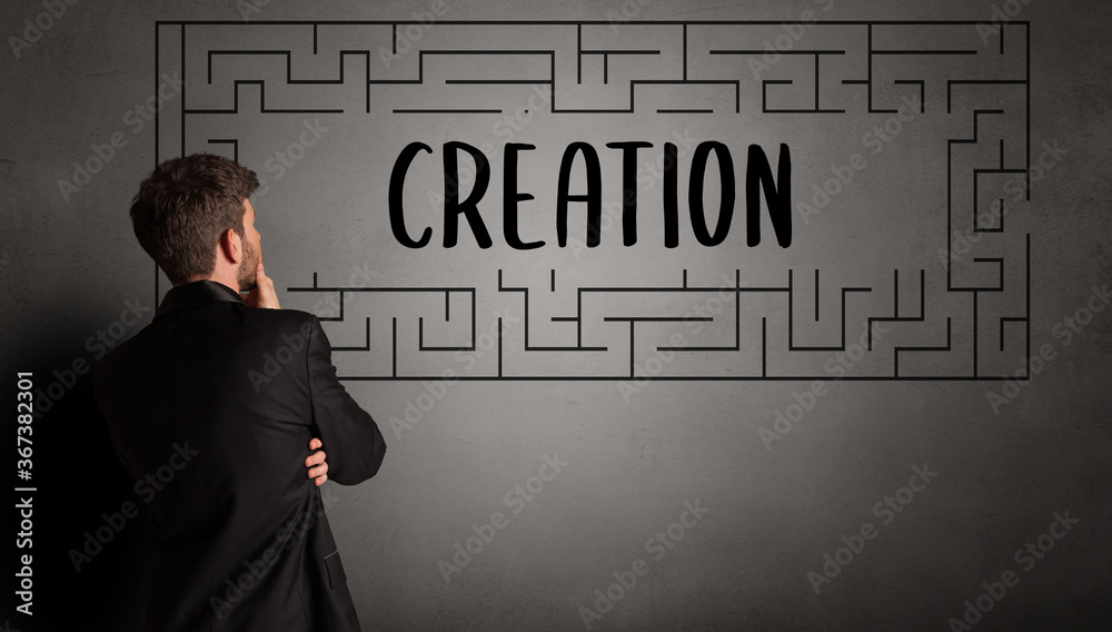 businessman drawing maze with CREATION inscription, business education concept