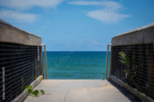 Blue skies and a beautiful walkway to the beach © John