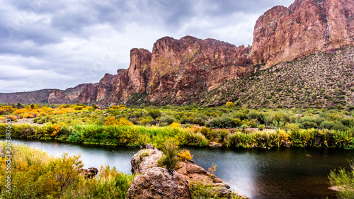 The Salt River and surrounding mountains with fall colored desert shrubs in central Arizona, United States of America