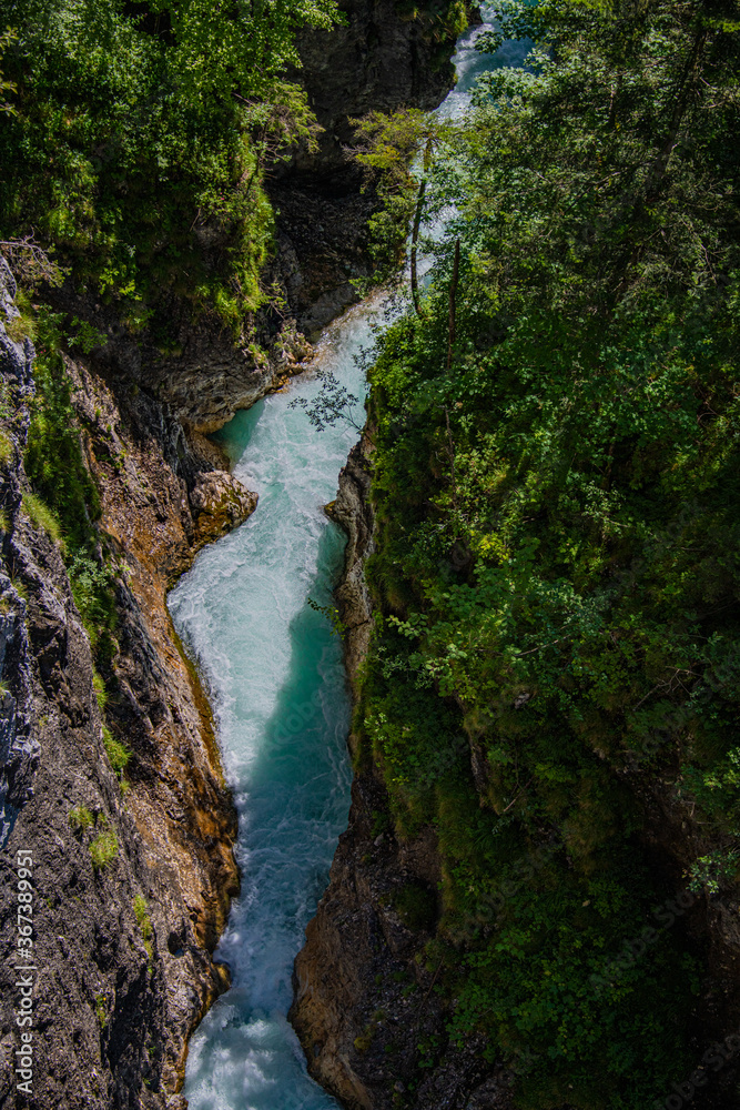 Forest, rocky shores and the beautiful blue stream water on a high altitude Forest, rocky shores and the beautiful blue stream water on a high altitude