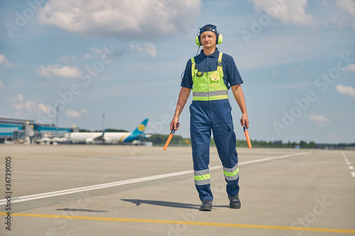 Signalman in headphones looking into the distance photo