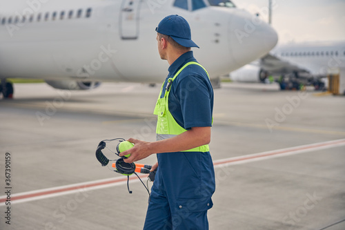 Signalman in uniform standing at the airdrome photo