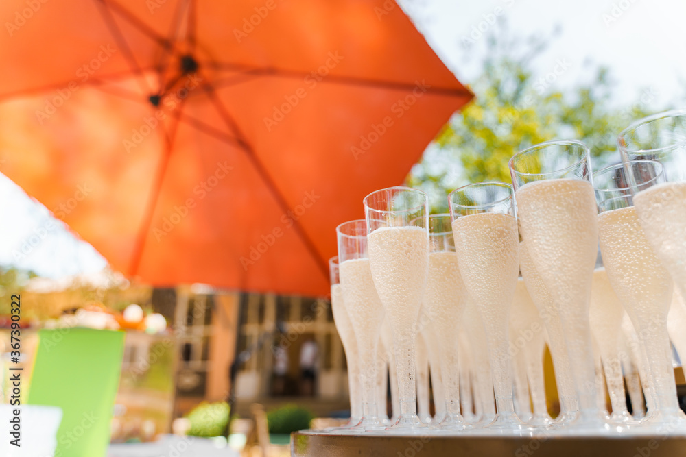 Many wine glasses with champagne. close up on the white table. Catering