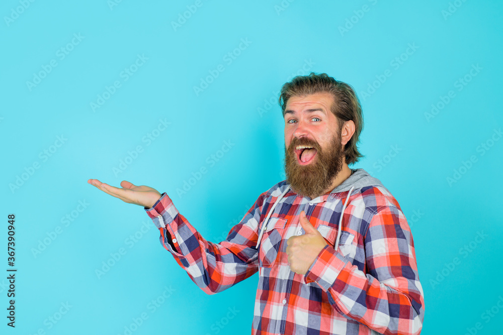 Bearded man shows something. Look attention. Feedback. People service tips concept. Advertisement. Advertising. Discount. Sale. Advertising content. Copy space for your text. Bearded man shows something. Look attention. Feedback. People service tips concept. Advertisement. Advertising. Discount. Sale. Advertising content. Copy space for your text.