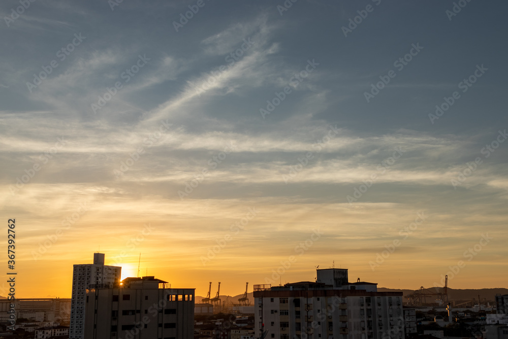 sunrise or sunset over the city silhouette