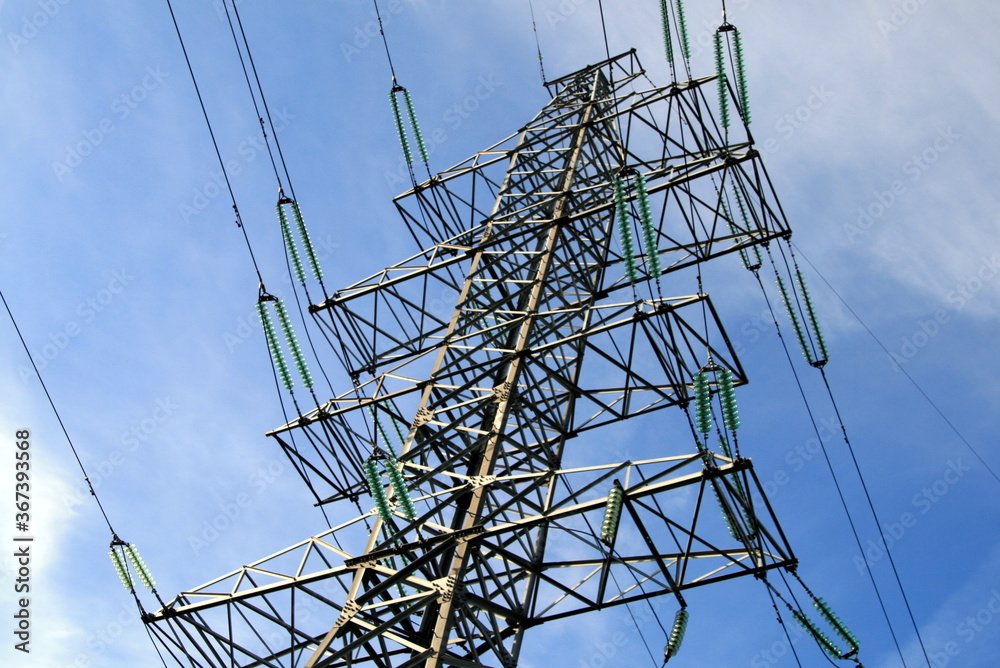 power line pole against a blue sky with clouds power line pole against a blue sky with clouds