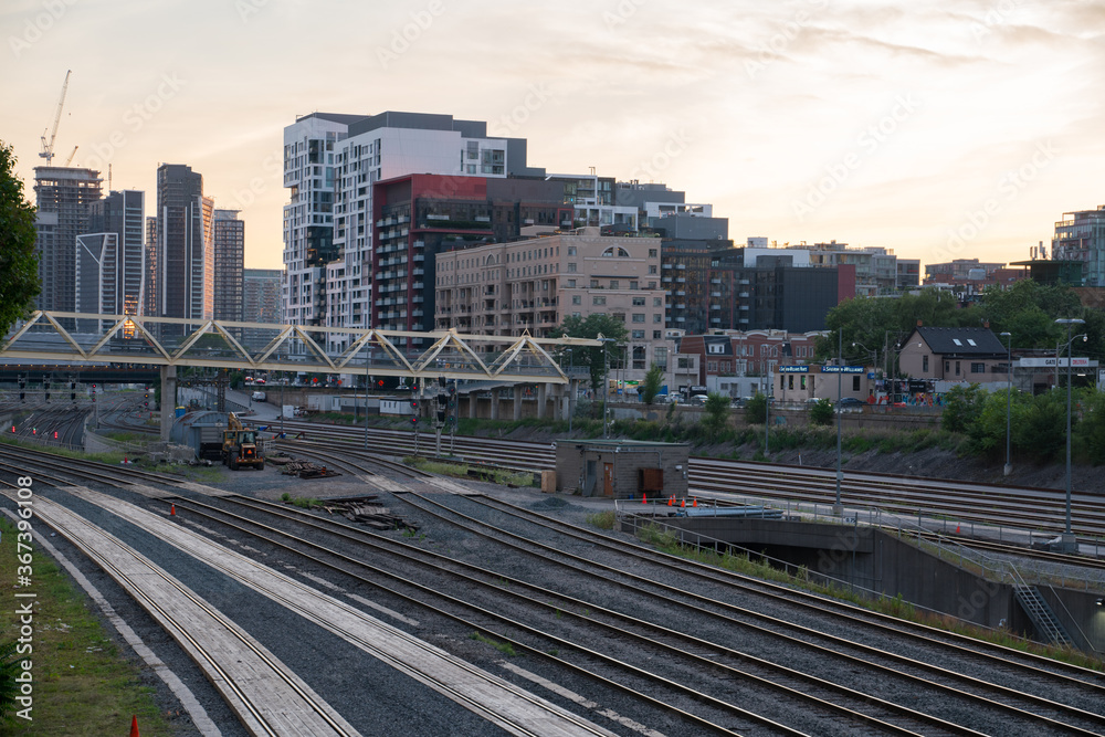 View of Urban Metropolitan City during Sunset with railway tracks and dense buildings
