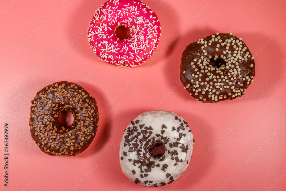 Tasty donuts on pink background. Top view Tasty donuts on pink background. Top view