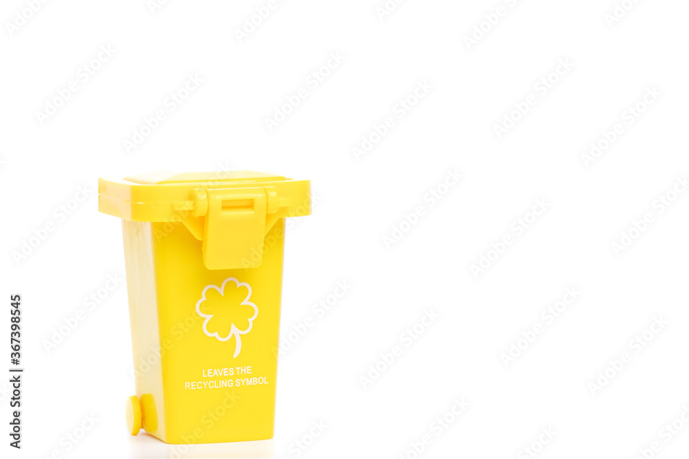 Large yellow trash can garbage bin with wheel, isolated on white background Large yellow trash can garbage bin with wheel, isolated on white background