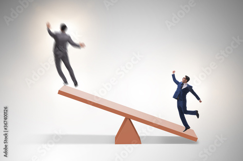 Competition concept with businessman and seesaw