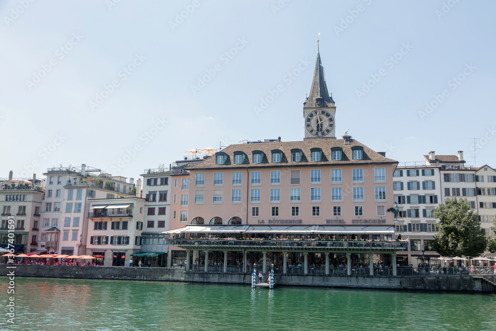 Zurich, Switzerland - 1 August, 2019: view on the Stadthausquai quay over the Limmat river