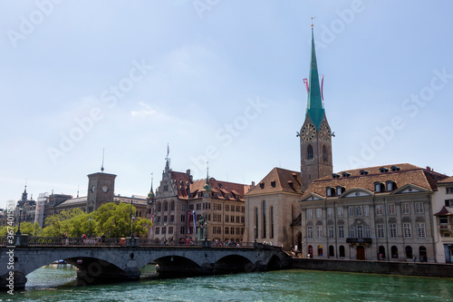 Panorama view of historic city center of Zurich with Fraumunster Church and Munsterbucke crossing river Limmat, Switzerland photo