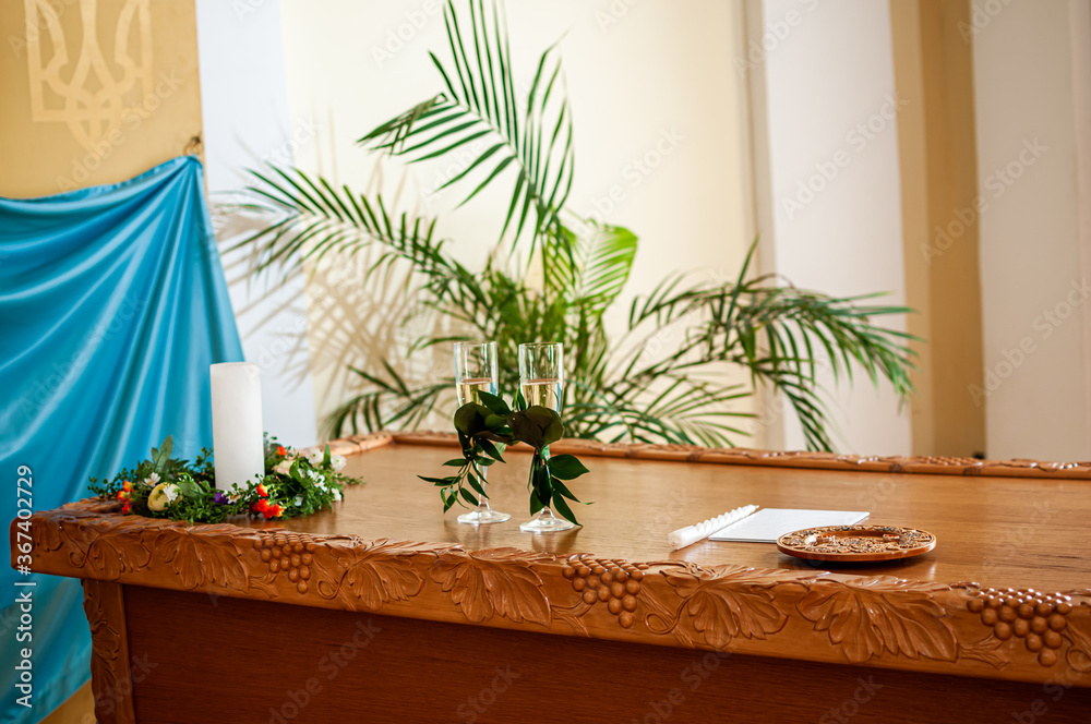 glasses of champagne are decorated with green branches on the table glasses of champagne are decorated with green branches on the table