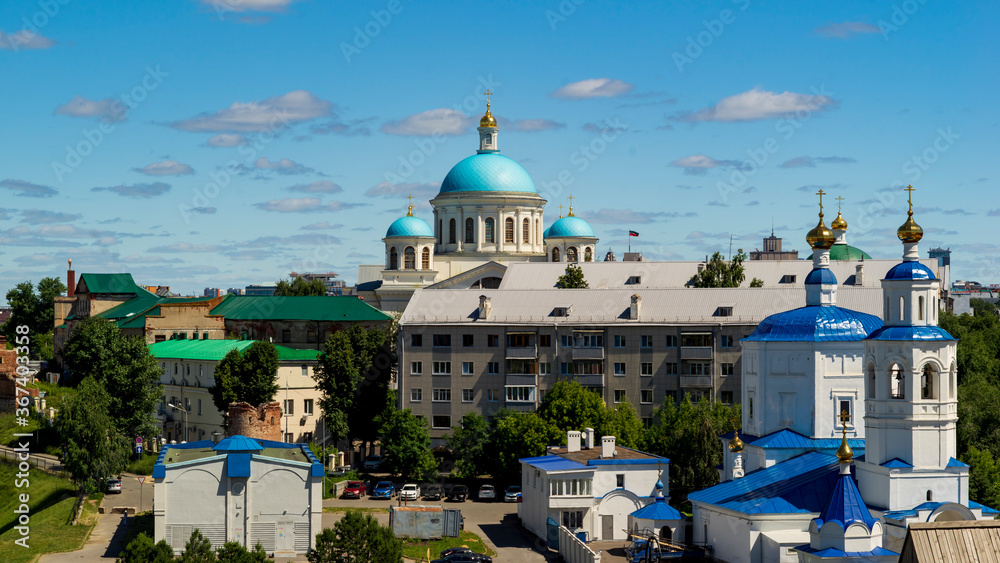 Kazan, Russia - June 21 2020: architecture of different times, foreground on the right-the Church of the Holy great Martyr Paraskeva Friday, background of the dome of the Kazan Cathedral