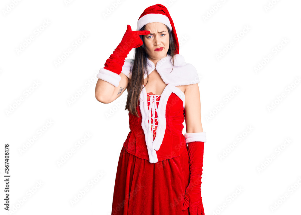 Young beautiful caucasian woman wearing santa claus costume pointing unhappy to pimple on forehead, ugly infection of blackhead. acne and skin problem Young beautiful caucasian woman wearing santa claus costume pointing unhappy to pimple on forehead, ugly infection of blackhead. acne and skin problem