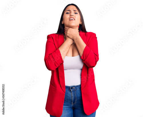 Young beautiful brunette woman wearing elegant clothes shouting and suffocate because painful strangle. health problem. asphyxiate and suicide concept.