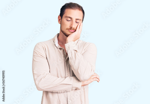 Young handsome caucasian man wearing casual clothes thinking looking tired and bored with depression problems with crossed arms. © Krakenimages.com