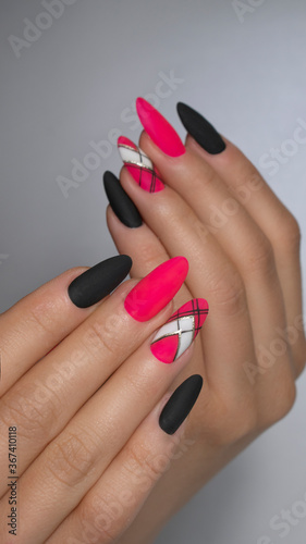  Manicure nail paint . beautiful female hand with colorful nail art design manicure