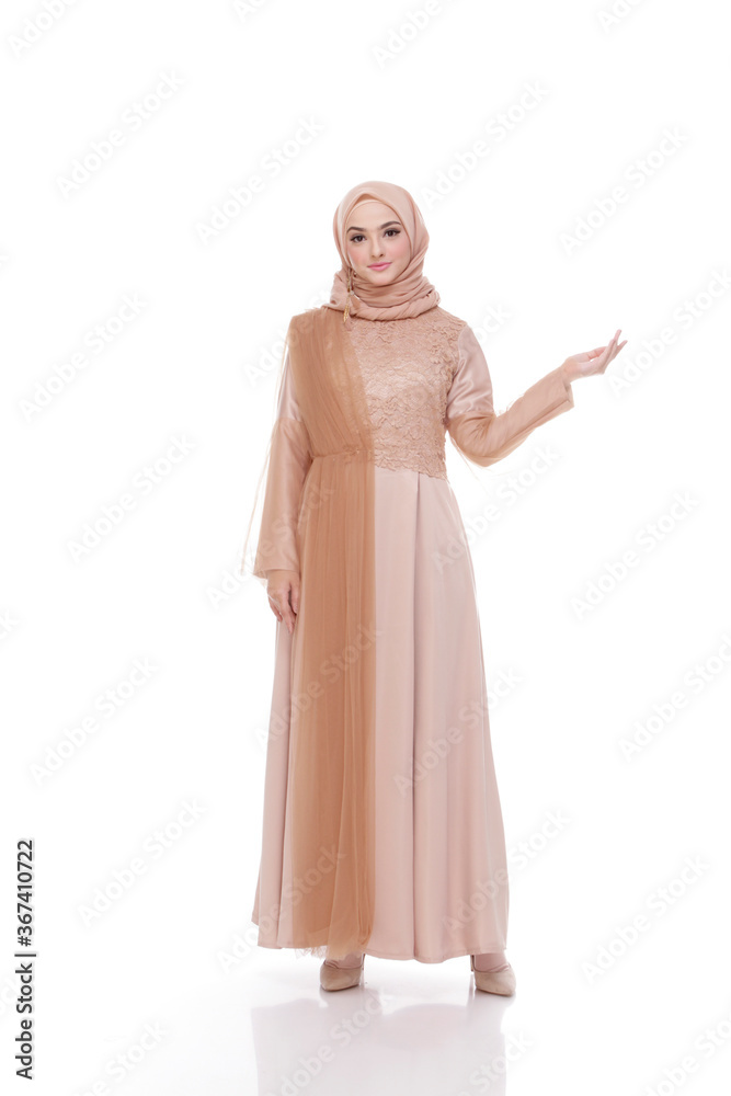 Beautiful islamic female model wearing hijab fashion, a modern lifestyle outfit for muslim woman. Concept a wedding dress, beauty or eidul fitri. A asian girl model wearing hijab on indoor photoshoot