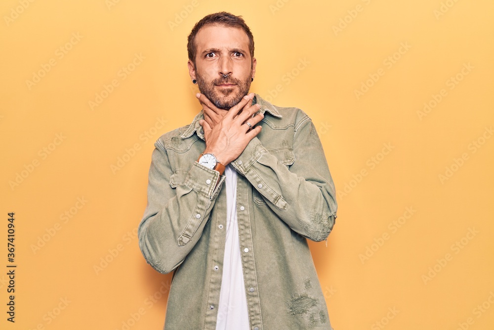 Young handsome man wearing casual clothes shouting and suffocate because painful strangle. health problem. asphyxiate and suicide concept. Young handsome man wearing casual clothes shouting and suffocate because painful strangle. health problem. asphyxiate and suicide concept.
