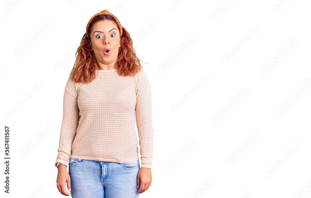 Young latin woman wearing casual clothes and diadem afraid and shocked with surprise expression, fear and excited face. Young latin woman wearing casual clothes and diadem afraid and shocked with surprise expression, fear and excited face.