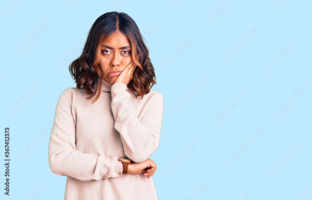 Young beautiful mixed race woman wearing winter turtleneck sweater thinking looking tired and bored with depression problems with crossed arms.