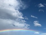rainbow in the sky with airplane.
虹と雲と小さな飛行機