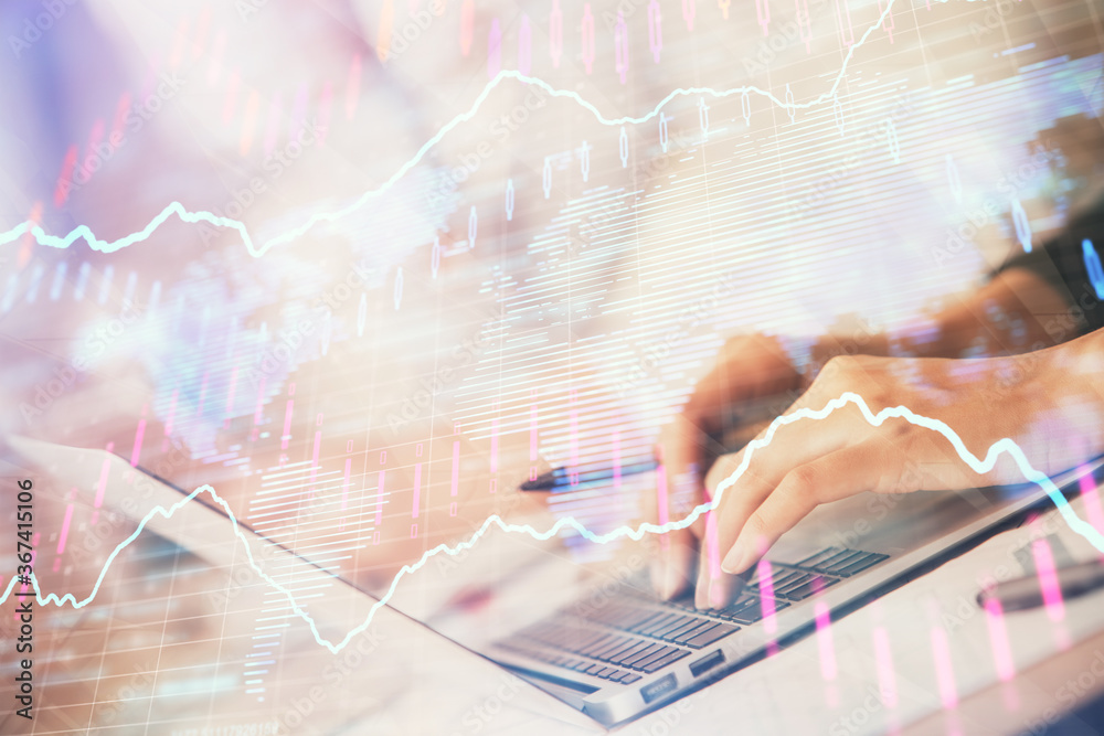 Double exposure of woman hands typing on computer and forex chart hologram drawing. Stock market invest concept.