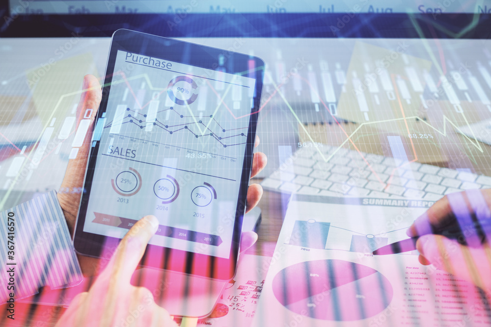 Multi exposure of man's hands holding and using a phone and financial chart drawing. Market analysis concept. Multi exposure of man's hands holding and using a phone and financial chart drawing. Market analysis concept.