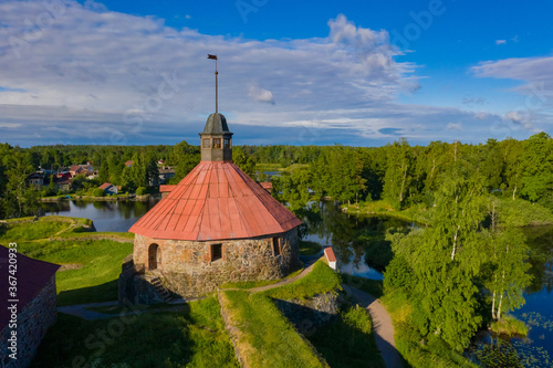 Karelia. Russia. Korela fortress on the background of forests and lakes. Stone fortress in the city of Priozersk. Ancient defensive structures against the background of the natural landscape. photo