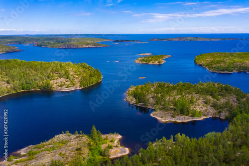 Aerial photography of the lake and Islands. A bird-eye view of the natural landscape. Lake and rocky Islands on a summer day. Wildlife. Natural landscape from the throne. © Grispb