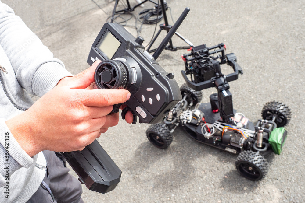 Setting up a remote-controlled video camera. Mobile video camera. Video recording equipment. The reporter sets up the equipment before shooting. Setting up a remote-controlled video camera. Mobile video camera. Video recording equipment. The reporter sets up the equipment before shooting.