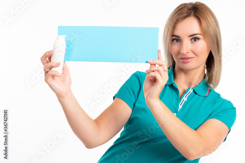 The girl is holding a bottl...