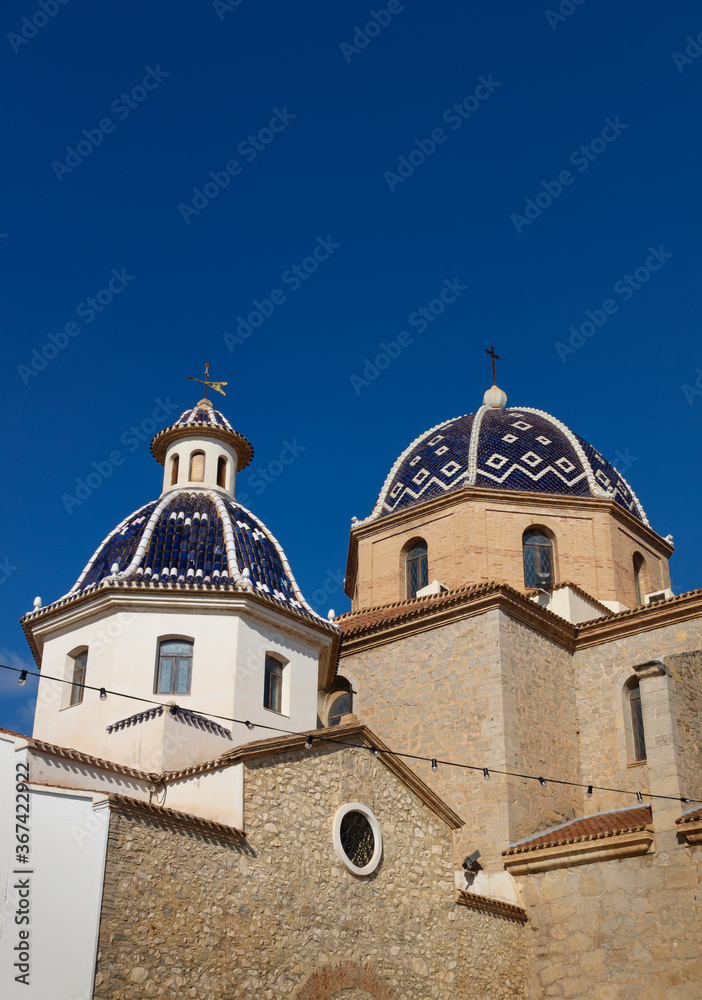 Our Lady of Solace Church with blue tiled domes and blue sky in Altea, Costa Blanca, Spain