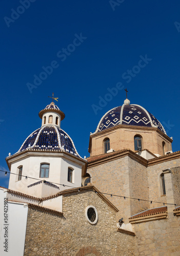 Our Lady of Solace Church with blue tiled domes and blue sky in Altea, Costa Blanca, Spain