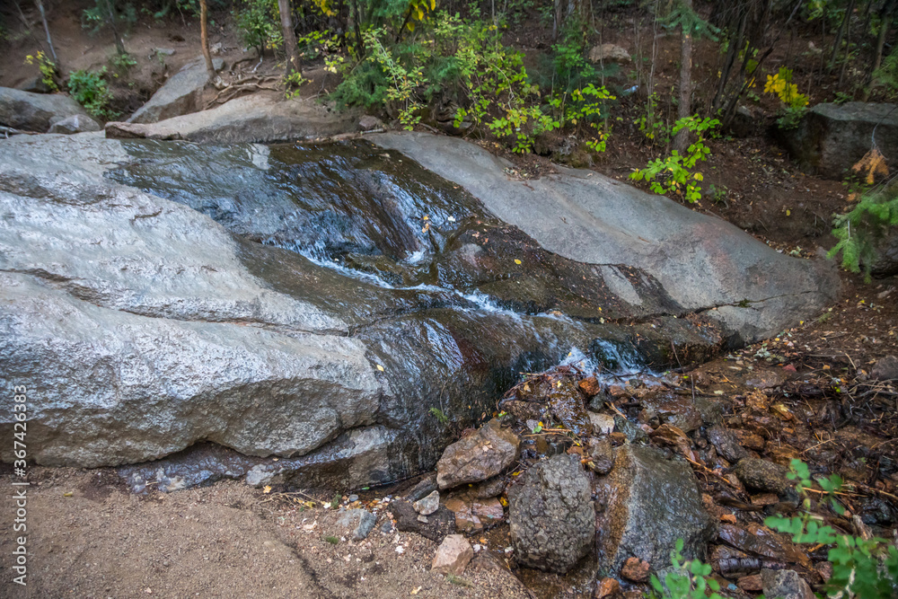 A narrow stream of water in Colorado Springs, Colorado A narrow stream of water in Colorado Springs, Colorado