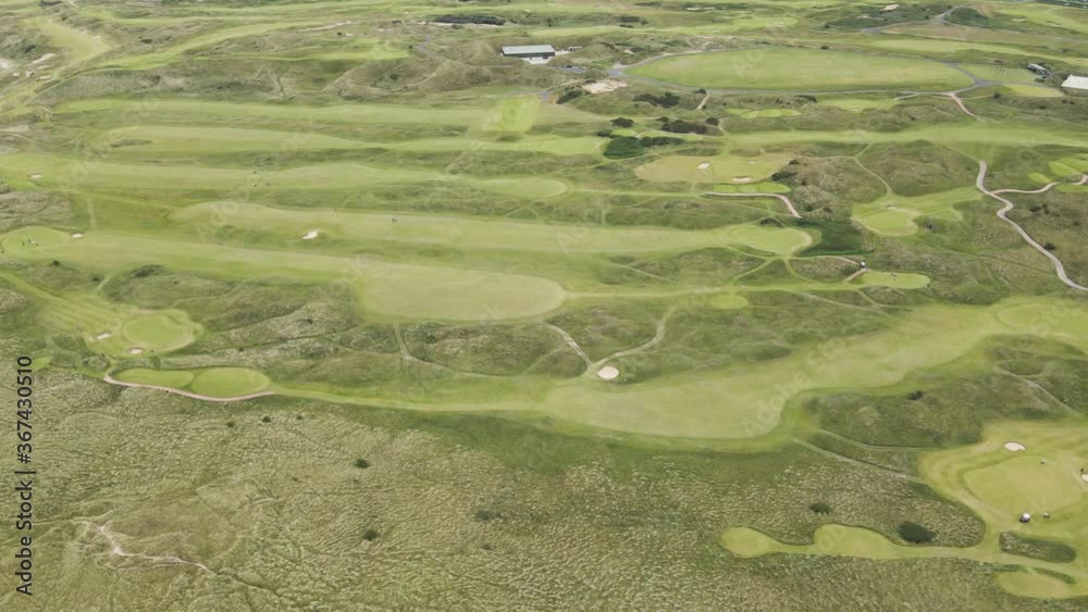 Scenic View Of The Royal Portrush Golf Club In The Town Of Portrush In Northern Ireland - aerial Scenic View Of The Royal Portrush Golf Club In The Town Of Portrush In Northern Ireland - aerial