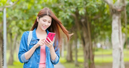 woman use smartphone in park