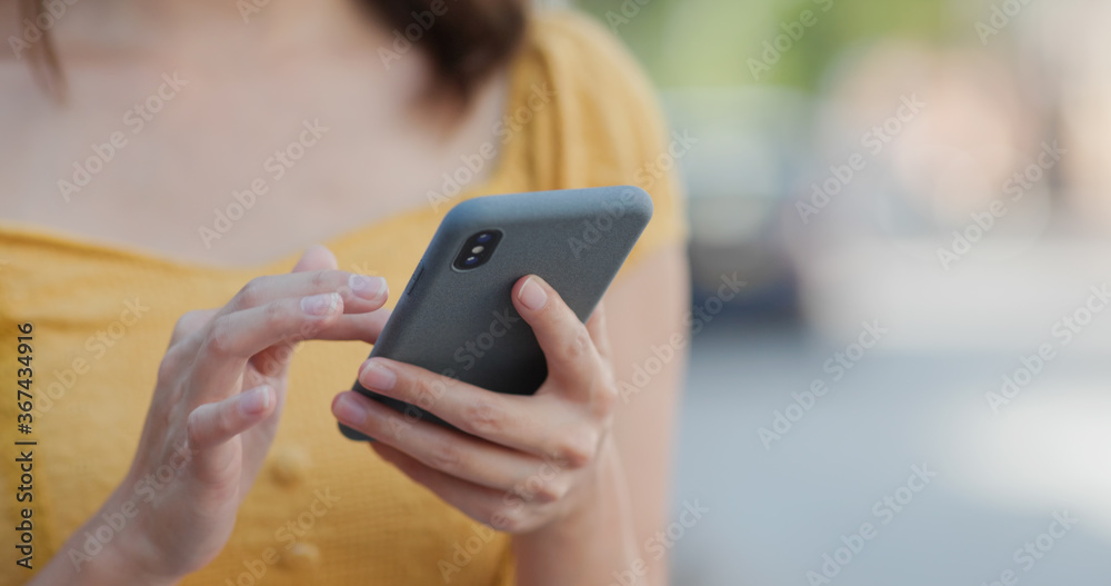 Woman use of mobile phone in city Woman use of mobile phone in city