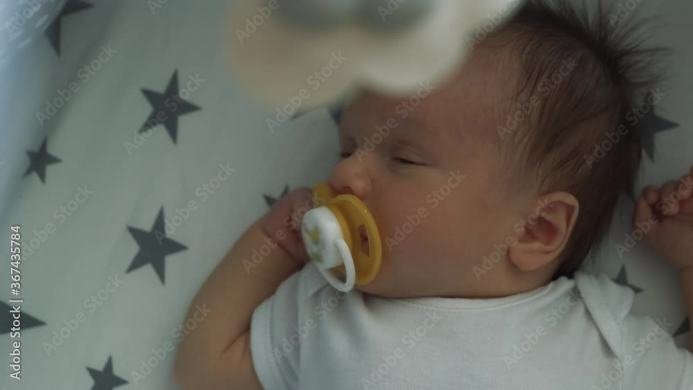 Vidéo Stock Handsome little boy sleeping sweetly in his crib. Infant