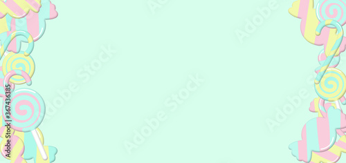 Colorful candy on light green background, lollipop