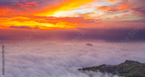 Fotografie Sea of fog on the mountain with twilight orange sky and sunlight on the morning