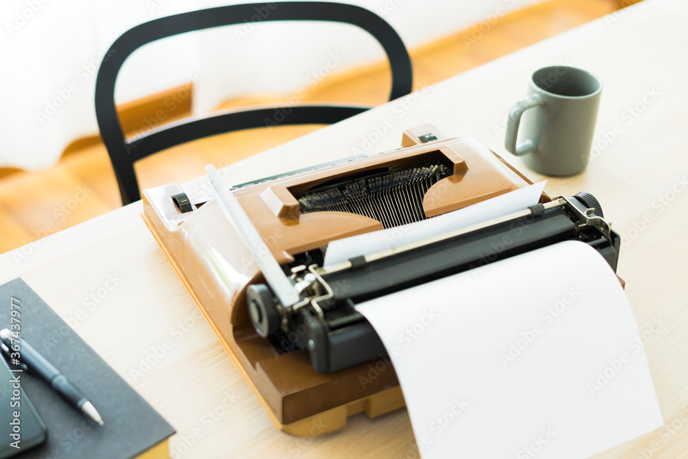 Old typewriter on the table with nobody, concept of working at home