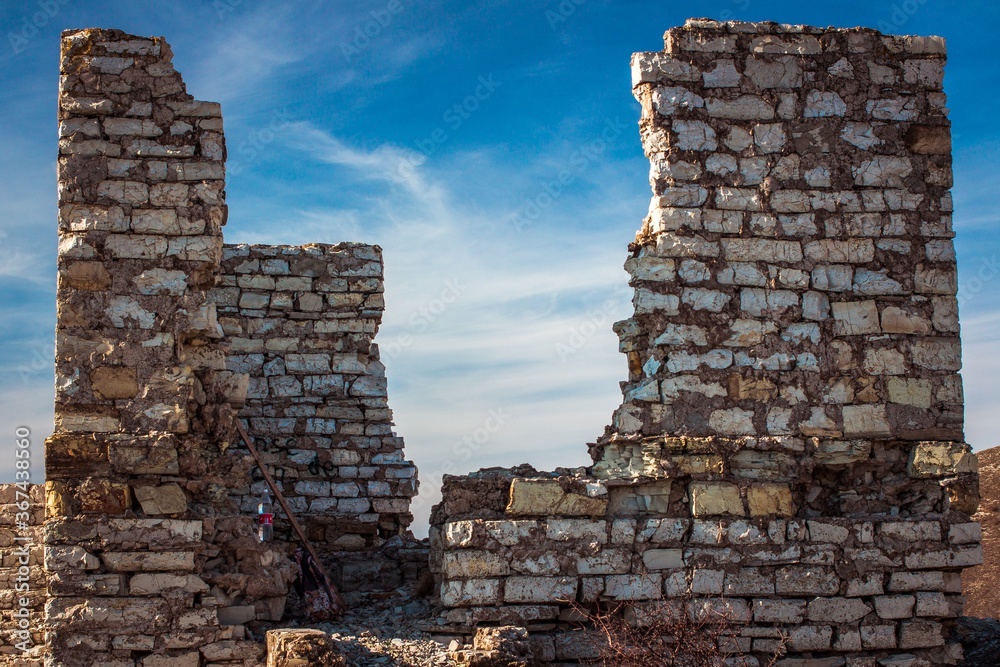 ruins of an old house against a blue sky