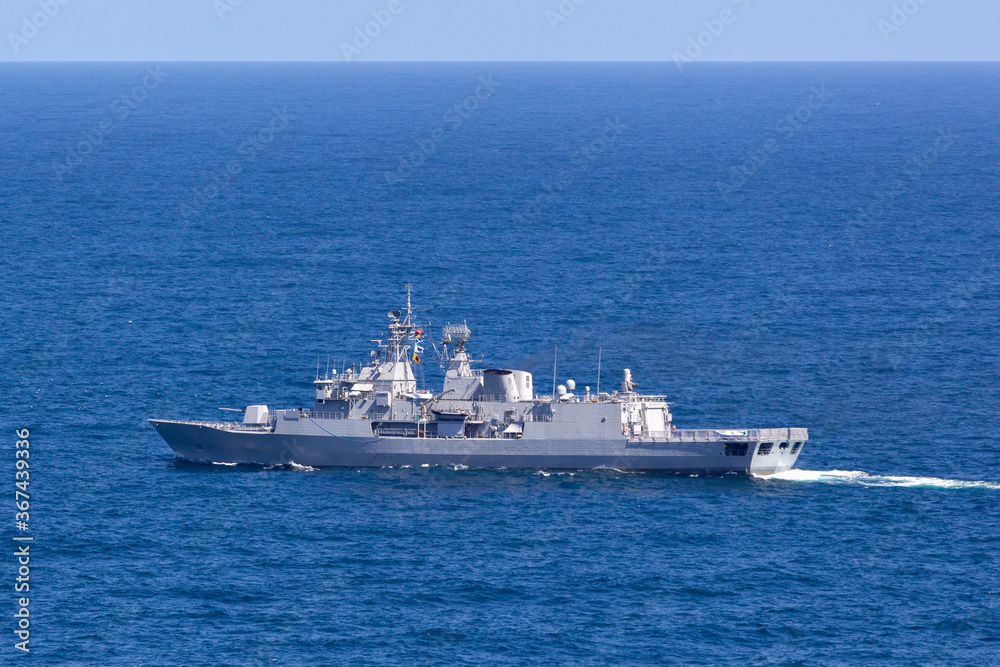 Warship sailing in the open ocean.