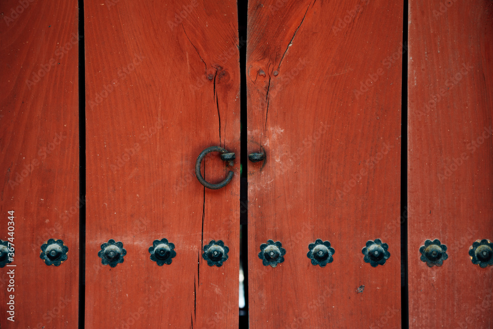 Fototapeta premium Korean traditional red wooden door at Jongmyo Shrine in Seoul, Korea