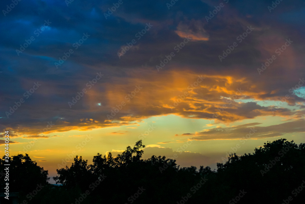 Obraz premium Sunset / sunrise with clouds, Panoramic view of a cloudy sky at sunset