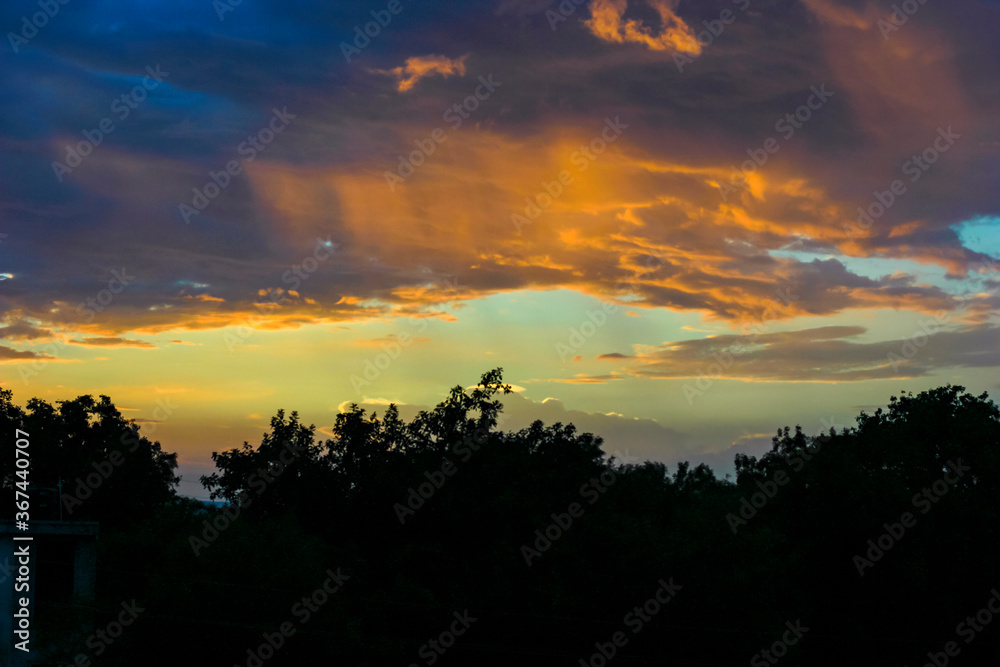 Fototapeta premium Sunset / sunrise with clouds, Panoramic view of a cloudy sky at sunset