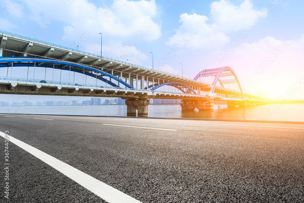 Fototapeta premium Asphalt road and viaduct with river in hangzhou,China.